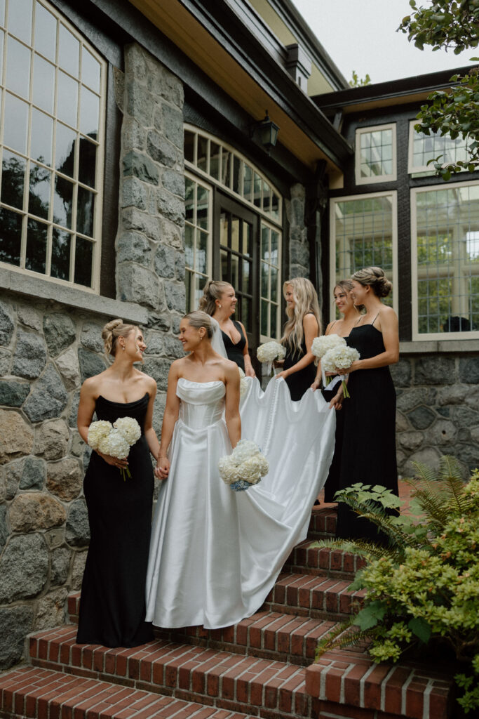 Bride and Bridesmaids on steps of Cecil Green Park House in Vancouver
