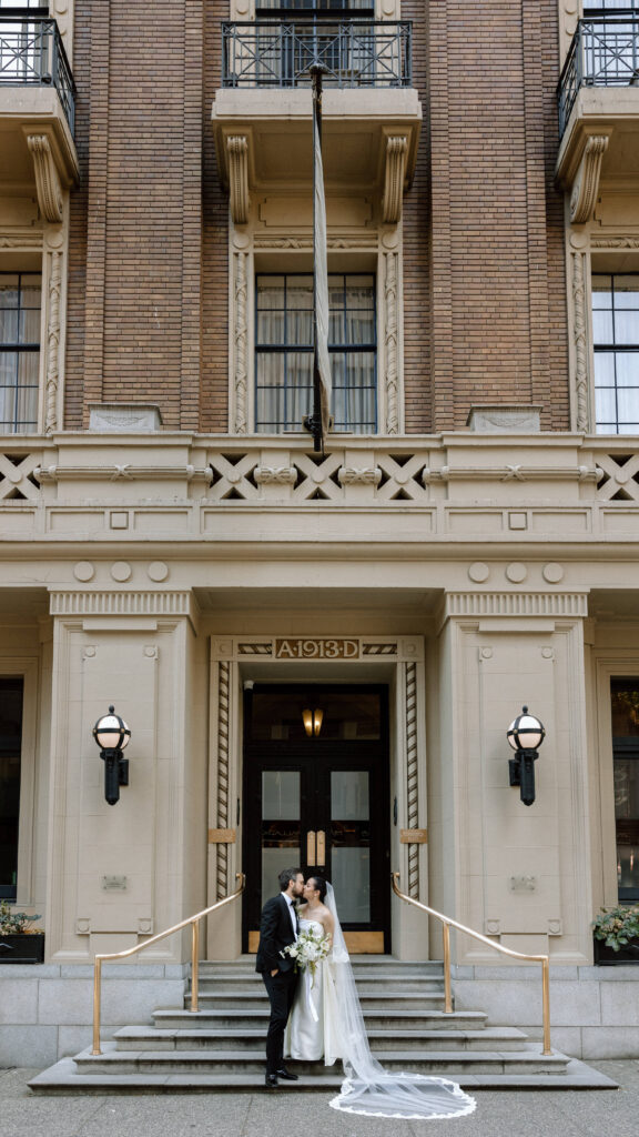 Bride and Groom on the outside of the Vancouver Club steps