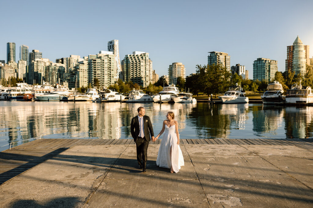 Bride and groom at golden hour on the dock at the Vancouver Rowing Club, a unique Lower Mainland wedding venue
