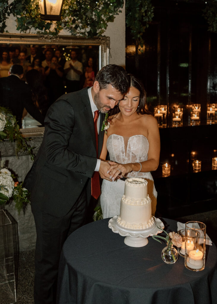 Bride and groom cutting the cake at Brix and Mortar Wedding venue Vancouver
