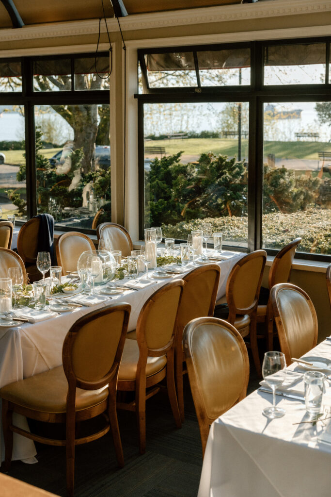 Cozy conservatory room set up for a wedding reception dinner in the Stanley Park Teahouse